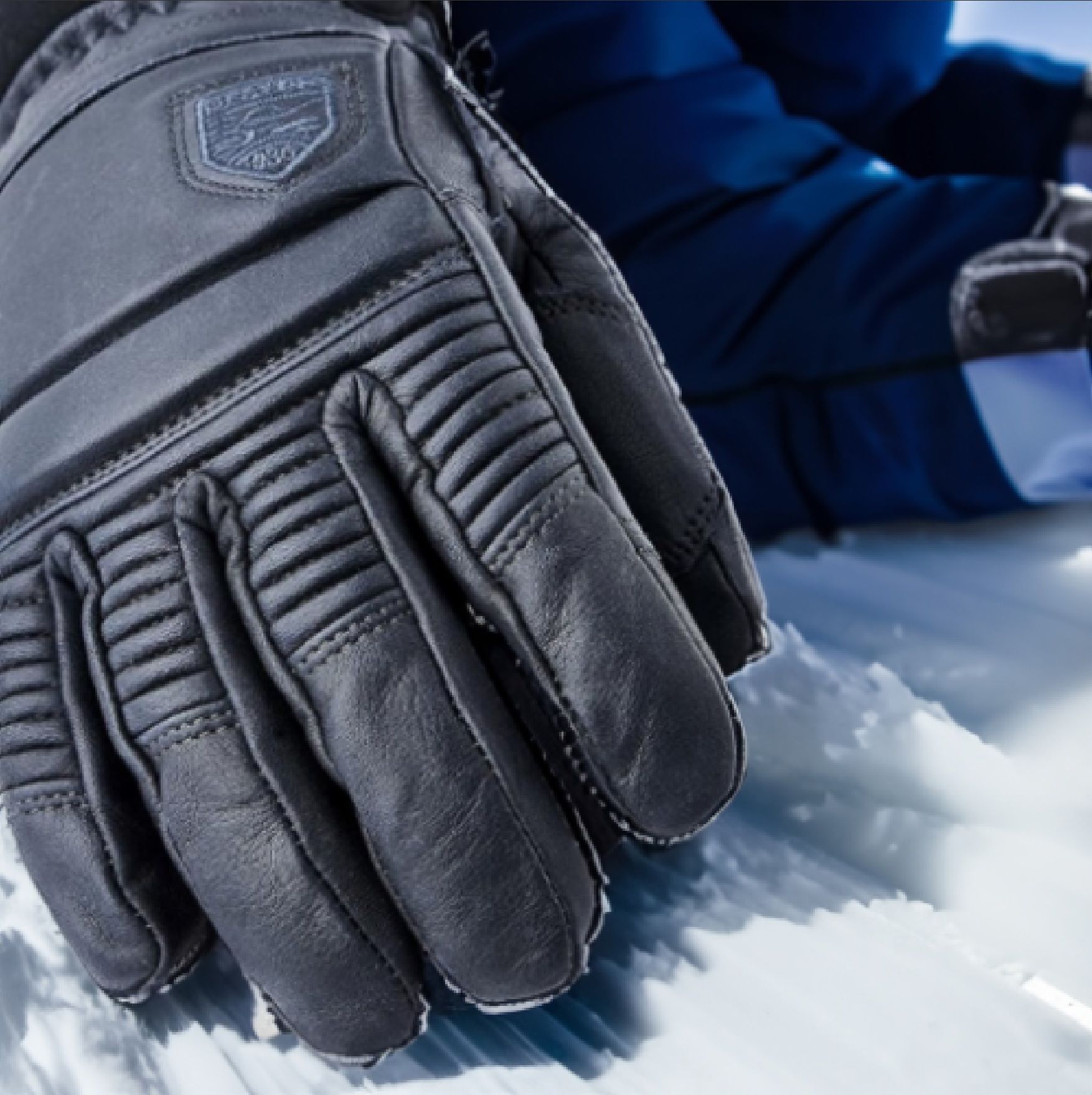 A pair of ski gloves with leather palms and waterproof membrane